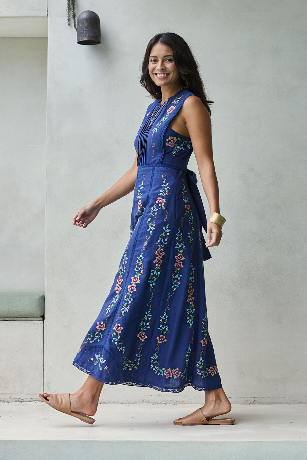 Model Tahnee wearing size 10 of the Fleur Muse Embroidered Dress in colour Navy (Blue), from the front, showing the whole outfit