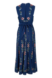Product shot of the Fleur Muse Embroidered Dress in colour Navy (Blue), from the back
