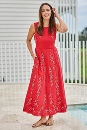 Model Tegand wearing size 10 of the Fleur Muse Embroidered Dress – Red in colour Red, from the front