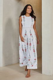 Model Tahnee wearing size 10 of the Fleur Muse Embroidered Dress in colour White (White), from the front, showing the whole outfit