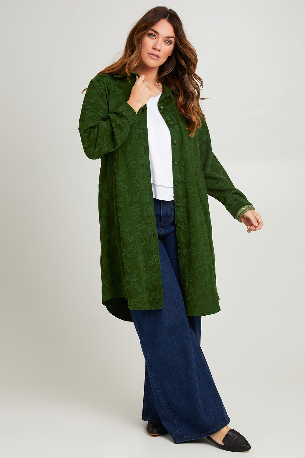 Model Laura wearing size 14 of the Day To Night Jacket To Dress in colour Forest (Green), from the front, showing the whole outfit