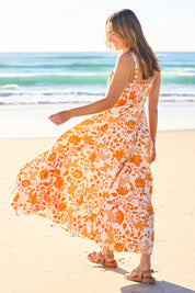 Model Tegan wearing size 10 of the Summer Fun Cotton Maxi Dress in colour Orangfleur, from the front, showing the whole outfit