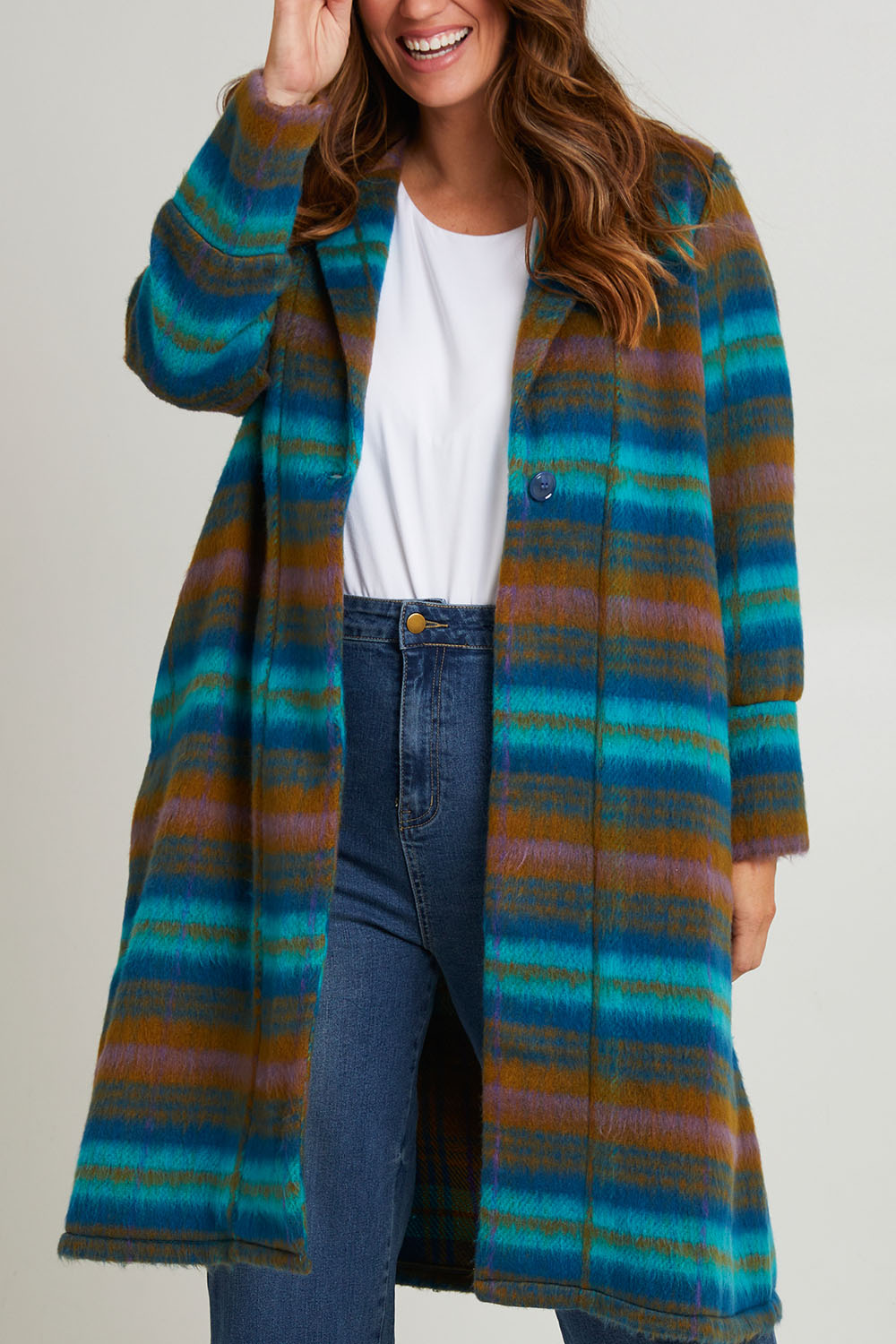 Model Laura wearing size 14 of the Check Me Out Coat in colour Tealcheck (Blue), from the front, cropped image