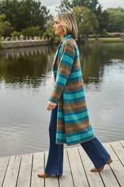 Model Tegan wearing size 10 of the Check Me Out Coat in colour Tealcheck (Blue), from the front, showing the whole outfit