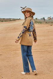 Model Tegan wearing size 10 of the Tigers Eye Cotton Jacket in colour Rust, from the front, showing the whole outfit