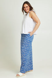 Model Jane wearing size 14 of the By The Water Skirt in colour Bluefish (Blue), from the front, showing the whole outfit