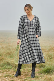 Model Tegan wearing size 10 of the Ready For A Picnic Smock Dress in colour Blkcheck (Black), from the front, showing the whole outfit