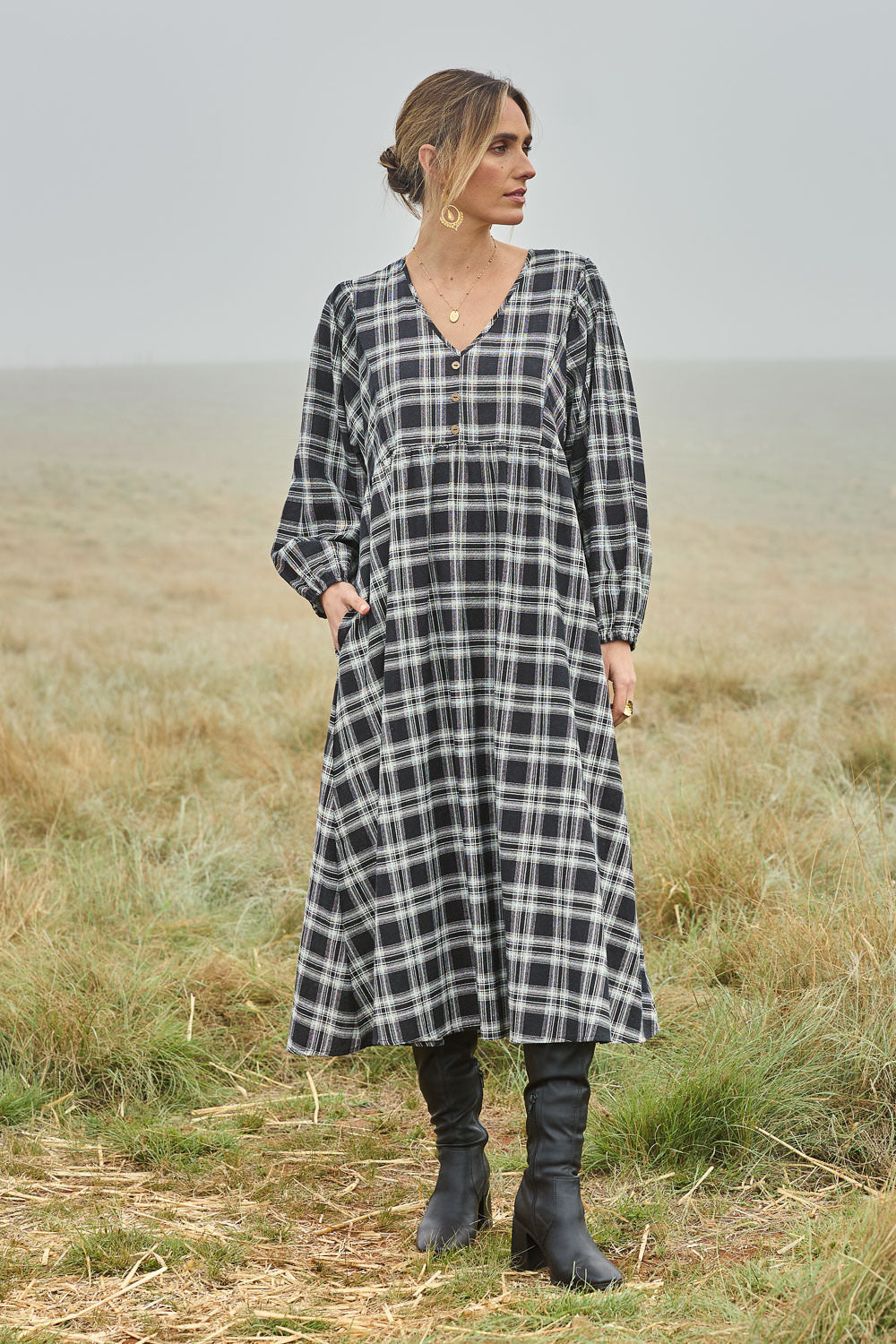 Model Tegan wearing size 10 of the Ready For A Picnic Smock Dress in colour Blkcheck (Black), from the front, showing the whole outfit