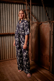 A model wearing the Wild Horses Oversized Shirt in colour Navyhorse (Blue), from the front, showing the whole outfit