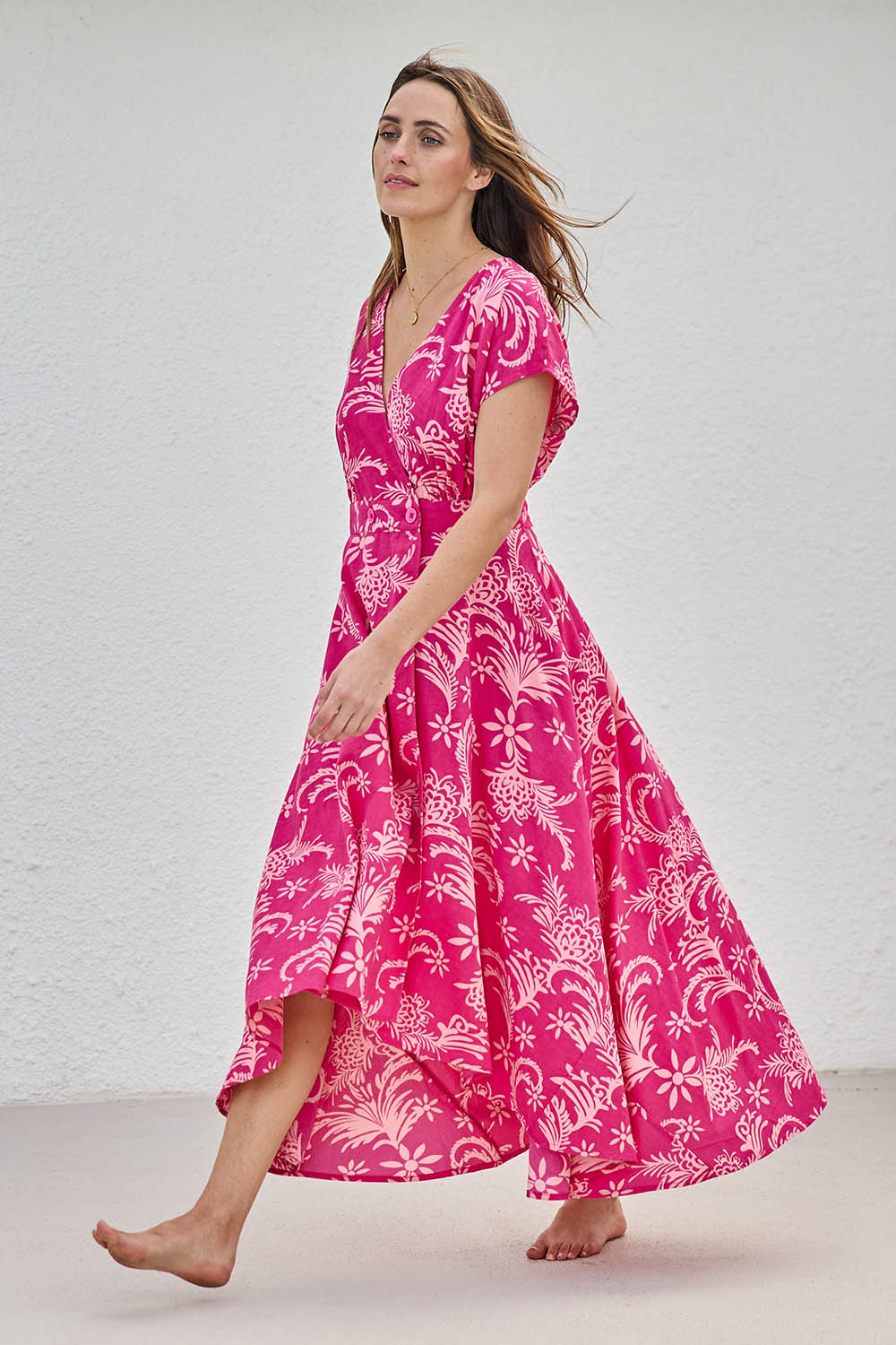 Model Tegand wearing size 10 of the Double Take Wrap Dress - Pinkfleur in colour Pinkfleur, from the front