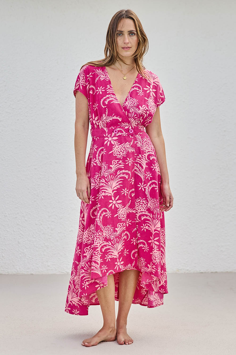 Model Tegand wearing size 10 of the Double Take Wrap Dress - Pinkfleur in colour Pinkfleur, from the front