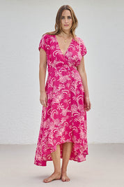 Model Tegand wearing size 10 of the Double Take Wrap Dress - Pinkfleur in colour Pinkfleur, from the front