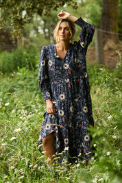 Model Tegan wearing size 10 of the Falling Flowers Maxi Dress in colour Navyfleur (Blue), from the front, showing the whole outfit
