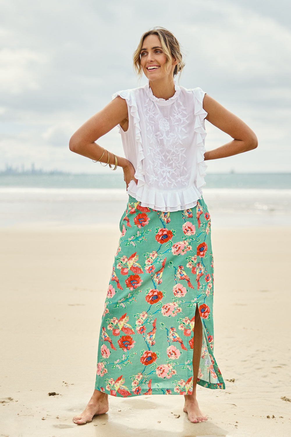 Model Tegan wearing size 10 of the Bird Delight Cotton Skirt in colour Mintpink (Pink), from the front, showing the whole outfit