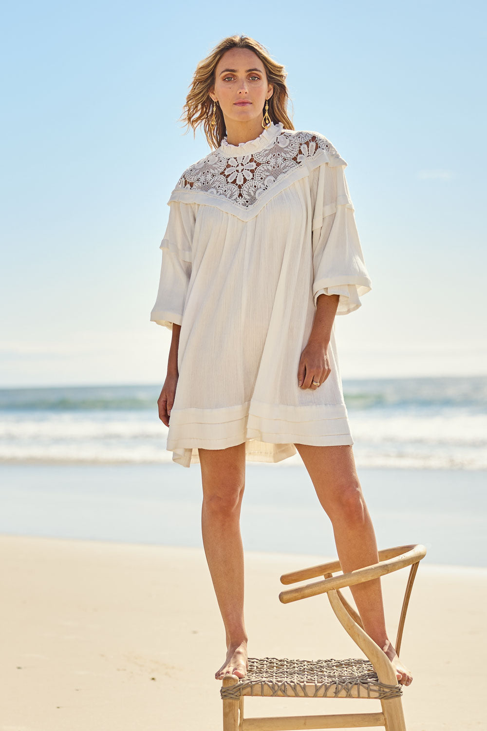Model Tegan wearing size 10 of the Romance Me Dress in colour Milk (White), from the front, showing the whole outfit