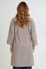 Model Laura wearing size 14 of the Living Life Slouch Jacket in colour Bark, from the back