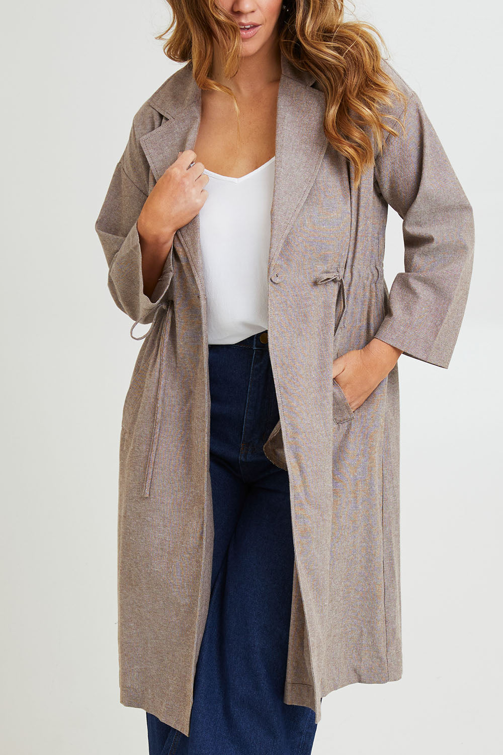 Model Laura wearing size 14 of the Living Life Slouch Jacket in colour Bark, from the front, cropped image