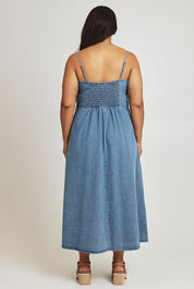 Model Ashleigh wearing size 16 of the For All Seasons Denim Dress in colour Denim (Blue), from the back