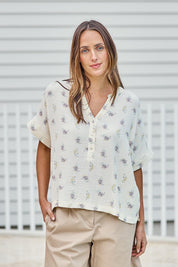 Model Tegand wearing size 10 of the Grandpa And Me Fleur Cotton Top – Creamfleur in colour Creamfleur, in a cropped view