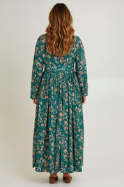 Model Laura wearing size 14 of the Divine Day Wrap Dress in colour Greenfleur (Green), from the back