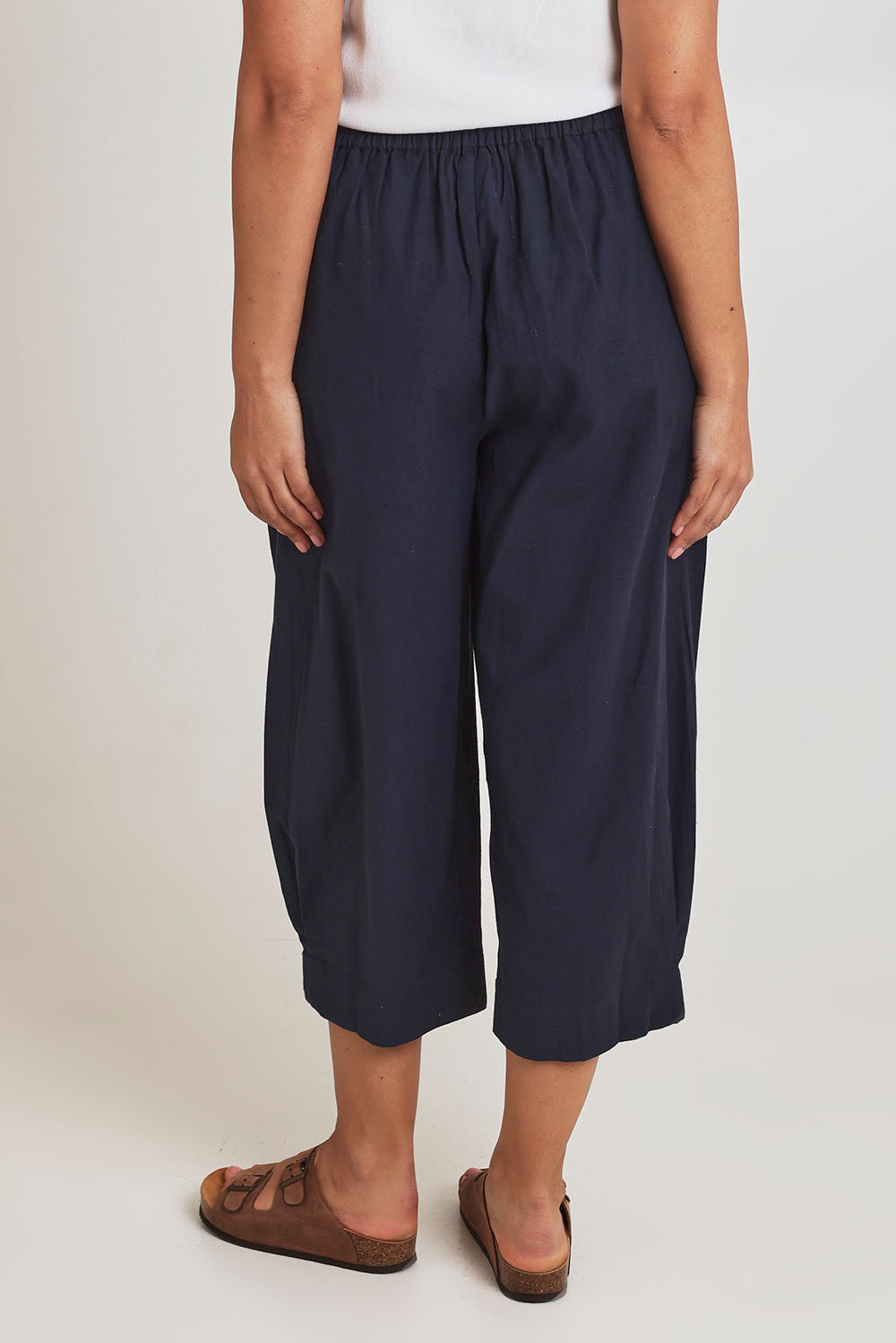 Model Terri-Leigh wearing size 14 of the You Had Me At First Glance Pants in colour Indigo (Blue), from the back