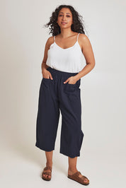 Model Terri-Leigh wearing size 14 of the You Had Me At First Glance Pants in colour Indigo (Blue), from the front, showing the whole outfit