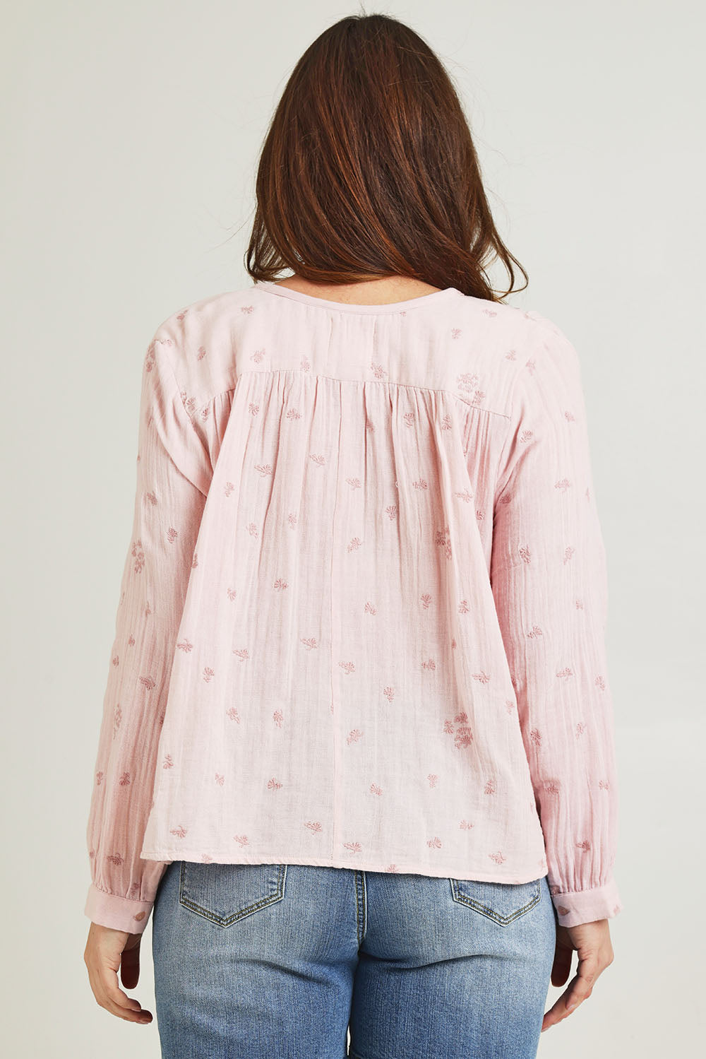 Model Jane wearing size 14 of the By The Meadow Embroidered Blouse in colour Pink (Pink), from the back