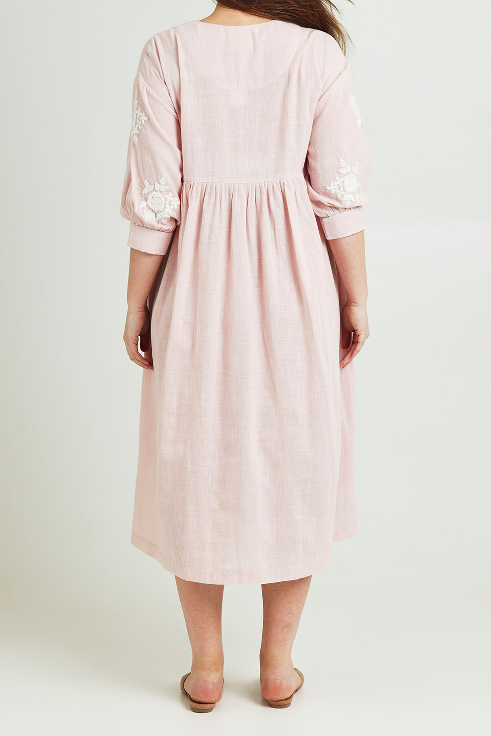 Model Jane wearing size 14 of the Day Dreaming Embroidered Dress in colour Dustypink (Pink), from the back