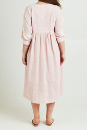 Model Jane wearing size 14 of the Day Dreaming Embroidered Dress in colour Dustypink (Pink), from the back