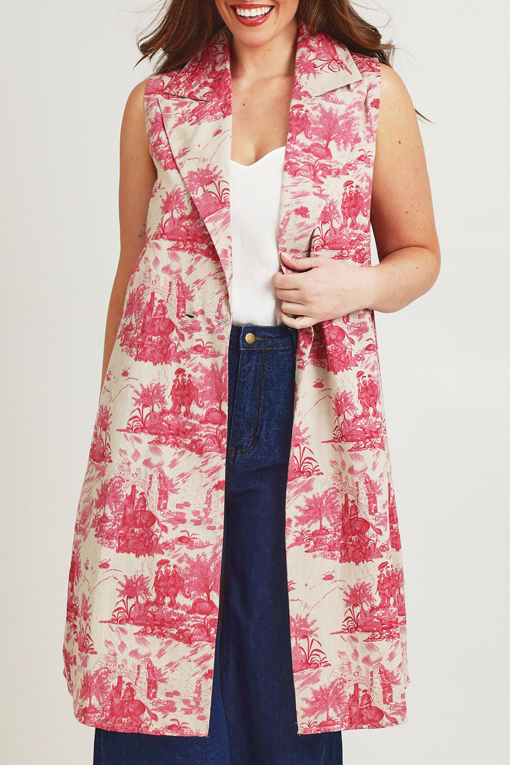 Model Jane wearing size 14 of the Toile De Jouy Vest in colour Pinktoile (Pink), from the front, cropped image
