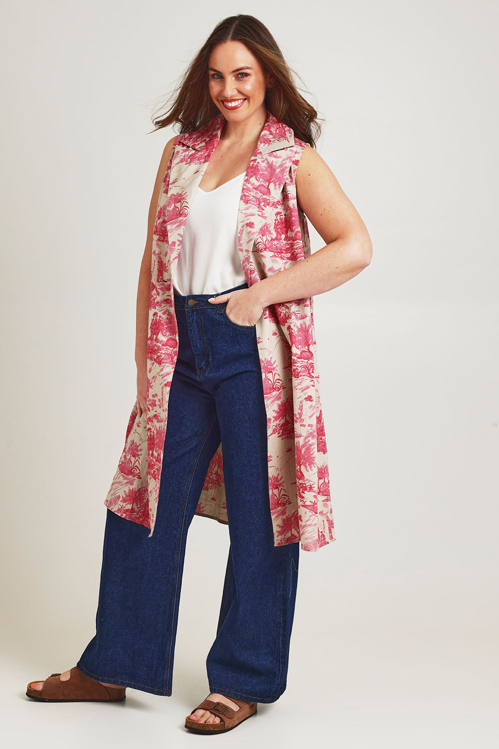 Model Jane wearing size 14 of the Toile De Jouy Vest in colour Pinktoile (Pink), from the front, showing the whole outfit