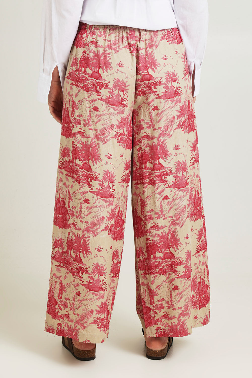 Model Jane wearing size 14 of the Toile De Jouy Pants in colour Pinktoile (Pink), from the back