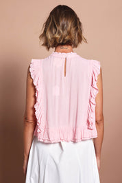 Model Riina wearing size 10 of the Easy Frills Embroidered Top in colour Blossom (Pink), from the back
