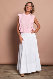 Model Riina wearing size 10 of the Easy Frills Embroidered Top in colour Blossom (Pink), from the front, showing the whole outfit
