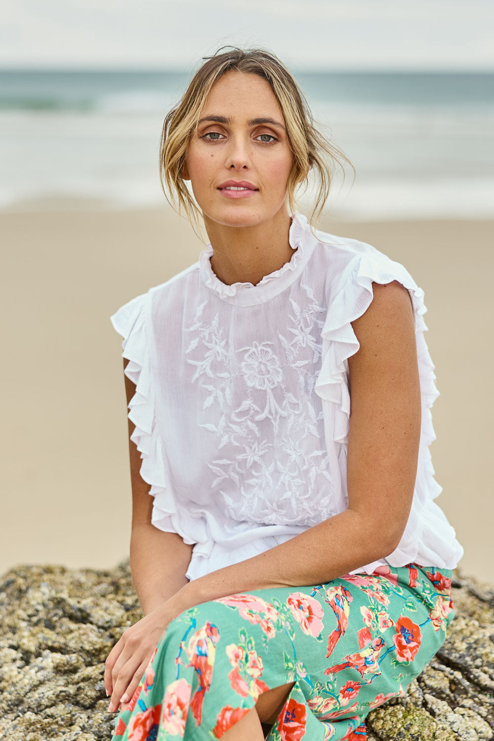 Model Tegan wearing size 10 of the Easy Frills Embroidered Top in colour Milk (White), from the front, showing the whole outfit