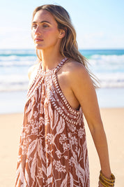 Model Tegan wearing size 10 of the Garden Party Halter Neck Dress in colour Cocoafleur, from the front, showing the whole outfit