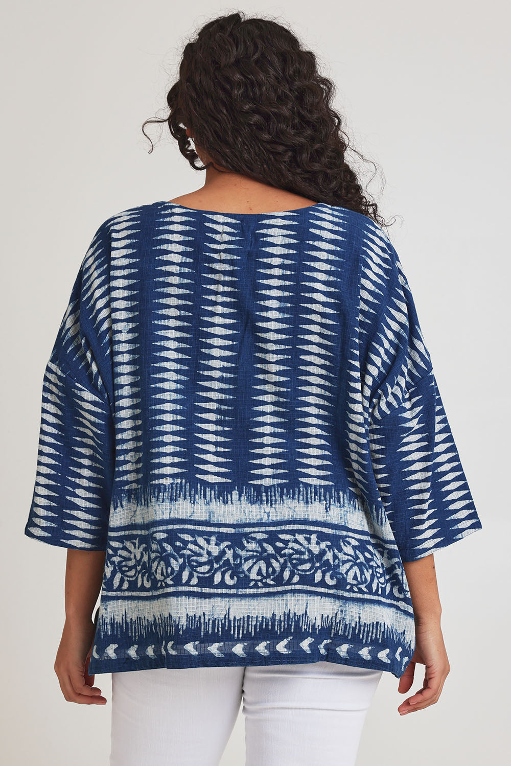 Model Terri-Leigh wearing size L of the True Delight Kota Doria Top in colour Indigo (Blue), from the back