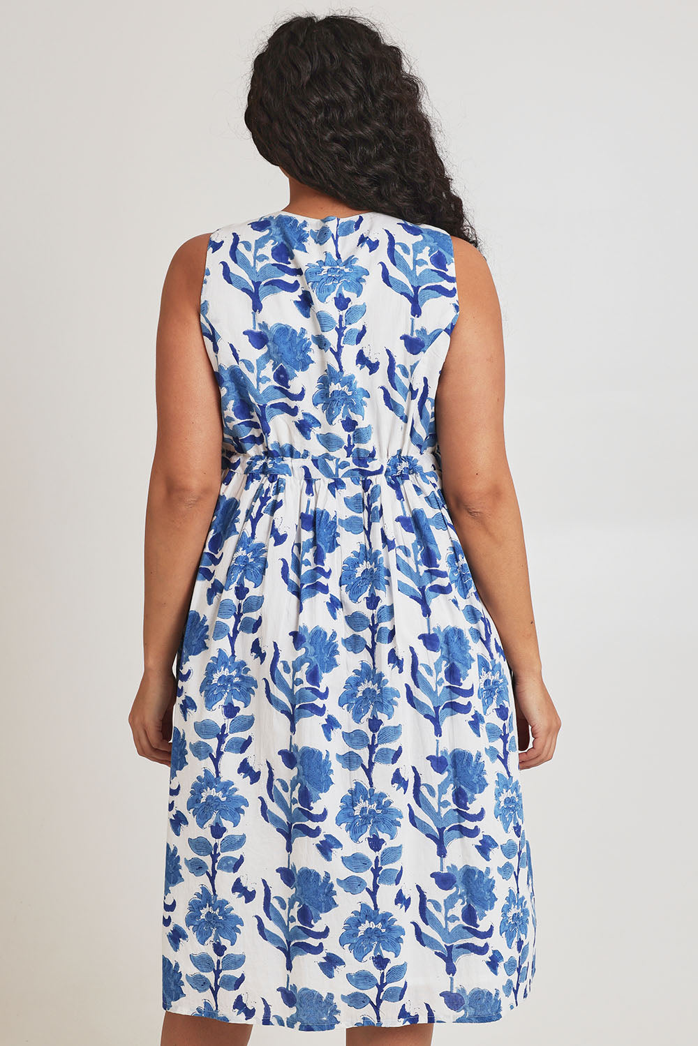Model Terri-Leigh wearing size 14 of the Always A Pleasure Dress in colour Bluefleur (Blue), from the back