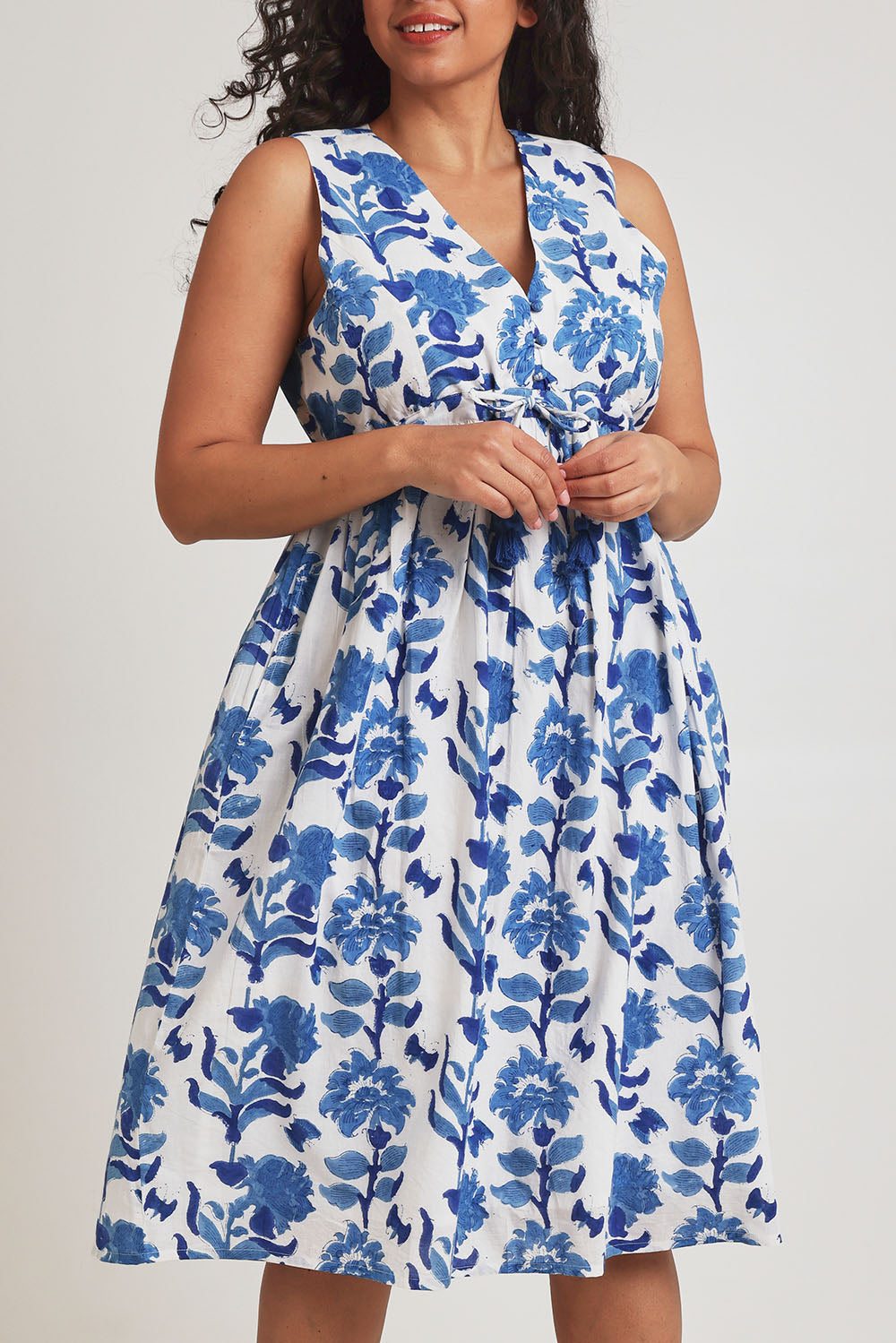 Model Terri-Leigh wearing size 14 of the Always A Pleasure Dress in colour Bluefleur (Blue), from the front, cropped image