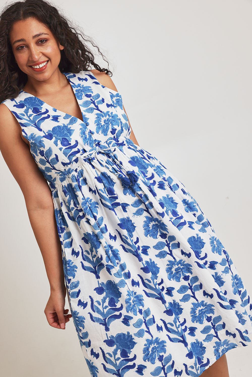 Model Terri-Leigh wearing size 14 of the Always A Pleasure Dress in colour Bluefleur (Blue), from the front, cropped image
