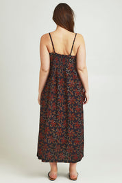Model Jane wearing size 14 of the At Sunset Maxi Dress in colour Midnight (Black), from the back