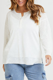 Model Laura wearing size L of the Go To Knit Boyfriend Henley in colour White (White), from the front, cropped image