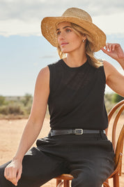 Model Tegan wearing size S of the Go To Knit Crew Tank in colour Black (Black), from the front, showing the whole outfit