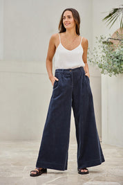 Model Tegand wearing size 10 of the Need You In My Life Cotton Cord Pants – Frenchnavy in colour Frenchnavy, from the front