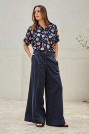 Model Tegand wearing size 10 of the Need You In My Life Cotton Cord Pants – Frenchnavy in colour Frenchnavy, from the front
