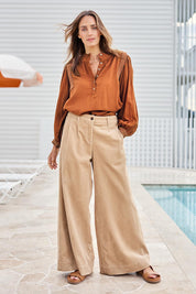 Model Tegand wearing size 10 of the Need You In My Life Cotton Cord Pants – Sand in colour Sand, from the front