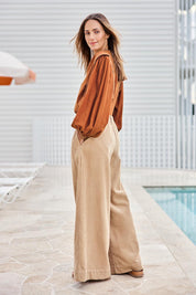 Model Tegand wearing size 10 of the Need You In My Life Cotton Cord Pants – Sand in colour Sand, from the front