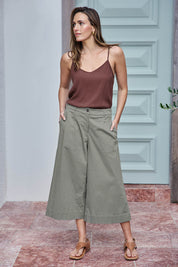 Model Tegand wearing size 10 of the Need You In My Life Cropped Pants - Sage in colour Sage, from the front