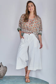 Model Tegand wearing size 10 of the Need You In My Life Cropped Pants - White in colour White, from the front