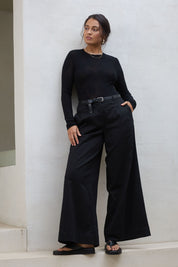 Model Tahnee wearing size 10 of the Need You In My Life Pants in colour Black (Black), from the front, showing the whole outfit